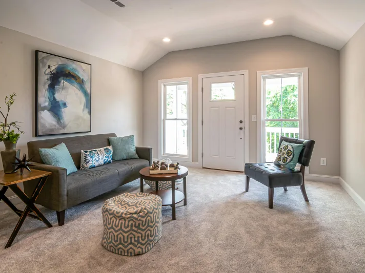Seating area with cozy carpet flooring in a Glendale AZ apartment