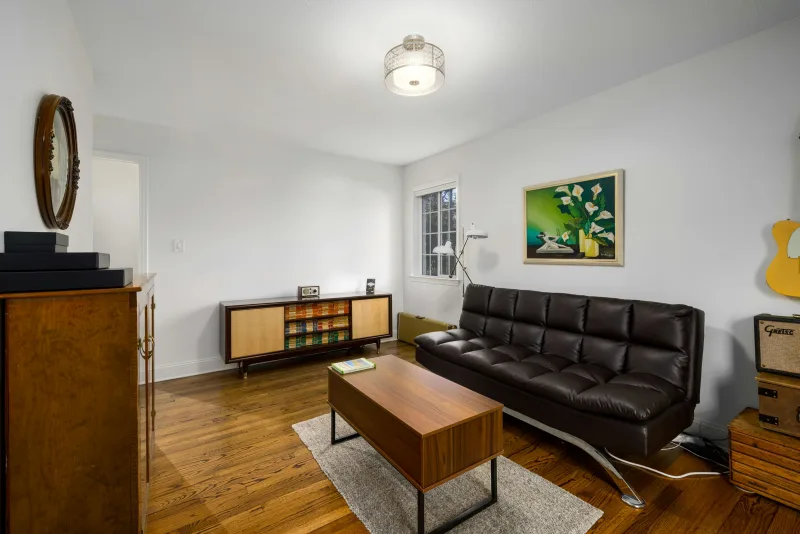 Rustic LVP Floors in a small living room with white walls