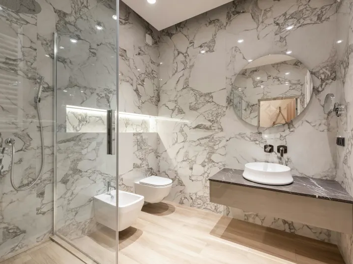 Luxury bathroom with marble tile walls