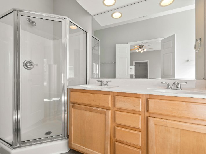 Bright bathroom with wooden cabinetry in Surprise AZ