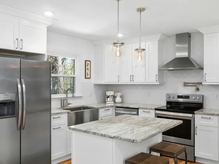 Remodeled kitchen with white cabinets and marble countertops in Arizona
