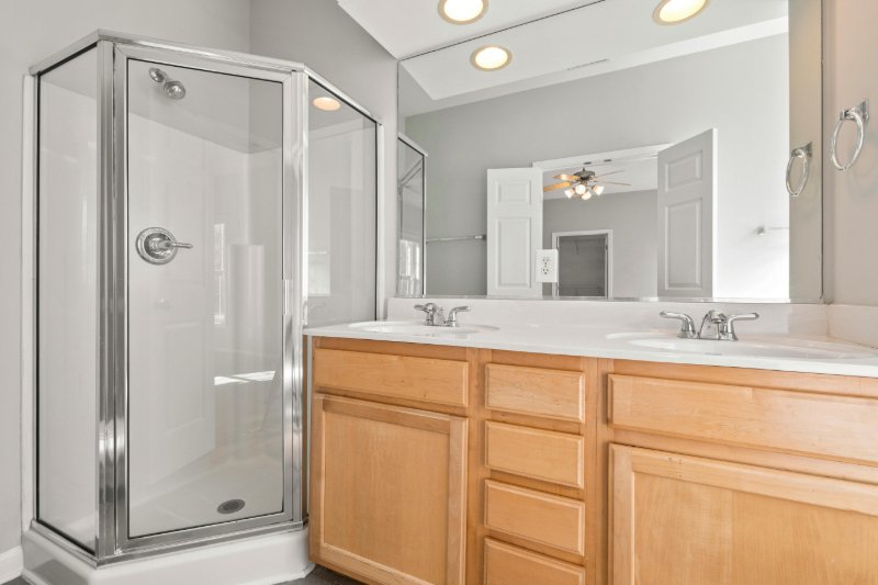 Bright bathroom with wooden cabinetry in Surprise AZ
