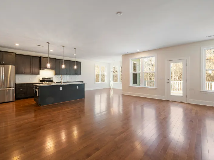 Warm Luxury Vinyl flooring in an open concept kitchen