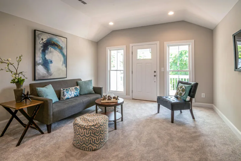 Seating area with cozy carpet flooring in a Glendale AZ apartment